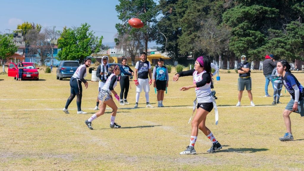 Young athletes engage in an exciting game of flag football outdoors in Toluca, Mexico.